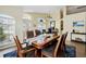 Bright dining room featuring a large wooden table with stylish chairs at 1823 Ashton E Dr, St Cloud, FL 34771