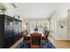 Well-lit dining room with dark wood furniture and a large window at 1823 Ashton E Dr, St Cloud, FL 34771