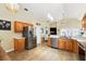 Spacious kitchen with stainless steel appliances, tiled flooring, and natural lighting at 1823 Ashton E Dr, St Cloud, FL 34771