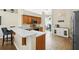 Kitchen featuring stainless steel appliances, bar seating and tiled flooring at 1823 Ashton E Dr, St Cloud, FL 34771