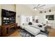 Comfortable living area featuring a TV, modern furnishings and views to the kitchen at 1823 Ashton E Dr, St Cloud, FL 34771
