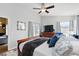 Comfortable main bedroom featuring wood floors, ceiling fan, and access to the outdoor area at 1823 Ashton E Dr, St Cloud, FL 34771