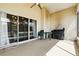 Covered screened porch featuring a ceiling fan, outdoor furniture, and access to the yard at 1823 Ashton E Dr, St Cloud, FL 34771