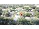 An aerial view of a neighborhood with mature trees, showcasing the property's location within the community at 2365 Paulette Dr, Haines City, FL 33844