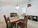 Cozy dining room with a wooden table and comfortable chairs for Gathering meals at 2365 Paulette Dr, Haines City, FL 33844