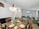 Elegant dining area with a stylish table, chandelier, and comfortable seating at 2365 Paulette Dr, Haines City, FL 33844