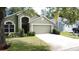 Inviting home exterior featuring a lush green lawn and neatly trimmed bushes, creating a welcoming atmosphere at 2365 Paulette Dr, Haines City, FL 33844