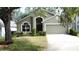 Beautifully landscaped front yard with a well-maintained lawn and mature plants enhancing the curb appeal at 2365 Paulette Dr, Haines City, FL 33844