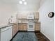 Bright kitchen featuring granite countertops, stainless appliances, and ample cabinet space at 2365 Paulette Dr, Haines City, FL 33844