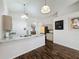A view of the kitchen featuring granite countertops, stainless steel sink, and modern appliances at 2365 Paulette Dr, Haines City, FL 33844