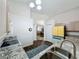 Bright kitchen with granite countertops, stainless steel sink, appliances, and hardwood floors at 2365 Paulette Dr, Haines City, FL 33844