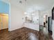 A view of the kitchen, which has a breakfast bar with granite countertops and modern pendant lighting at 2365 Paulette Dr, Haines City, FL 33844