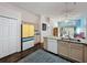 Open kitchen with a large island, stainless steel appliances, and adjacent dining area at 2365 Paulette Dr, Haines City, FL 33844