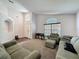 Bright living room with plenty of seating, a vaulted ceiling, and lots of natural light at 2365 Paulette Dr, Haines City, FL 33844