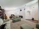 Expansive living area featuring a comfortable sofa, dining table, and stylish decor at 2365 Paulette Dr, Haines City, FL 33844