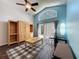 Bright living room with high ceilings, large window, hardwood floors, and access to the outdoor space at 2365 Paulette Dr, Haines City, FL 33844