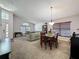 Open-concept living and dining area with vaulted ceilings and lots of natural light at 2365 Paulette Dr, Haines City, FL 33844
