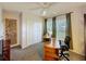 Well-lit office with a ceiling fan, large windows with views, and functional desk space at 2365 Paulette Dr, Haines City, FL 33844