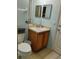Clean and functional bathroom with a single sink vanity, toilet, and tiled floor at 247 Verona Ave, Davenport, FL 33897
