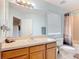 This bathroom features a large mirror, shower and tub combination, as well as a toilet and a single sink vanity at 247 Verona Ave, Davenport, FL 33897