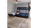 Comfortable bedroom featuring a bunk bed, wood floor, and neutral paint at 247 Verona Ave, Davenport, FL 33897