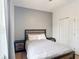 Bedroom with a simple bed, two end tables and a double door closet at 247 Verona Ave, Davenport, FL 33897