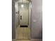 Interior entryway with a tiled floor, modern lighting, and a secure front door at 247 Verona Ave, Davenport, FL 33897