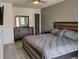 Comfortable main bedroom showcasing a spacious layout, ceiling fan, and wooden flooring at 247 Verona Ave, Davenport, FL 33897