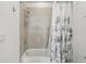Bathroom featuring a shower and neutral tiling at 256 Captiva Dr, Davenport, FL 33896