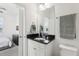 Modern bathroom featuring granite countertops with a view into the bedroom at 256 Captiva Dr, Davenport, FL 33896