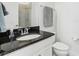 Bathroom featuring a granite countertop and a shower with modern finishes at 256 Captiva Dr, Davenport, FL 33896