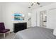 Bright bedroom featuring a ceiling fan, TV, and a comfortable chair at 256 Captiva Dr, Davenport, FL 33896