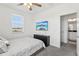 Bedroom featuring a ceiling fan, TV, window, and an en-suite bathroom with modern finishes at 256 Captiva Dr, Davenport, FL 33896