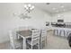 Dining area offering a view of the kitchen area with bar stool seating at 256 Captiva Dr, Davenport, FL 33896