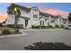 Charming townhome with modern architecture, lush landscaping, and convenient parking at 256 Captiva Dr, Davenport, FL 33896