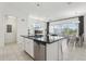Bright eat-in kitchen open to a spacious living room and dining area at 256 Captiva Dr, Davenport, FL 33896