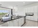 Stylish kitchen island featuring a stainless steel dishwasher with modern decor around the house at 256 Captiva Dr, Davenport, FL 33896