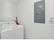 Functional laundry area with a washing machine at 256 Captiva Dr, Davenport, FL 33896