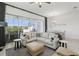 Bright living room, featuring comfortable seating and a view of the screened-in lanai at 256 Captiva Dr, Davenport, FL 33896