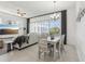 Open living and dining area with views of screened lanai at 256 Captiva Dr, Davenport, FL 33896