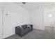 Upstairs loft area featuring a couch and carpet flooring at 256 Captiva Dr, Davenport, FL 33896