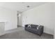 Second view of upstairs loft area featuring a couch and carpet flooring at 256 Captiva Dr, Davenport, FL 33896
