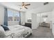 View of the main bedroom, with an office area in the background, featuring a neutral color scheme at 256 Captiva Dr, Davenport, FL 33896