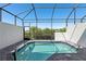 Inviting screened-in pool area with clear blue water and tranquil setting at 256 Captiva Dr, Davenport, FL 33896
