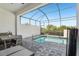 Inviting screened-in pool area with clear blue water and tranquil setting at 256 Captiva Dr, Davenport, FL 33896