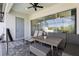 Covered patio with ceiling fan, outdoor seating and dining with pool view at 256 Captiva Dr, Davenport, FL 33896