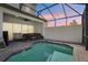 Relaxing screened-in pool area with lounge seating for outdoor enjoyment at 256 Captiva Dr, Davenport, FL 33896