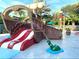 Nautical-themed splash pad with a pirate ship slide and interactive water features for  at 256 Captiva Dr, Davenport, FL 33896