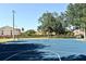 Well-maintained outdoor basketball court with clear markings, located near residential buildings and mature trees at 2778 Almaton Loop # 403, Kissimmee, FL 34747