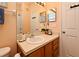This bathroom features a sink with mirrors, toilet, shower, and is brightly lit at 2778 Almaton Loop # 403, Kissimmee, FL 34747